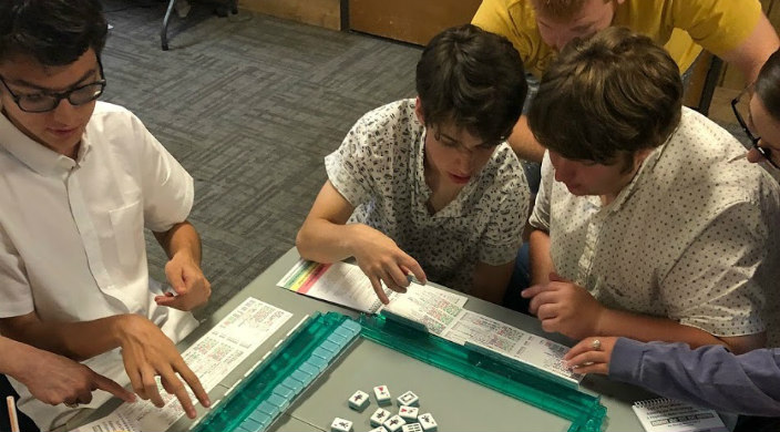 Campers learning to play mah jongg